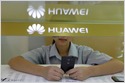 Internal memo shows that Huawei demoted two employees and cut their monthly pay for using an iPhone to send New Year greetings from its official Twitter account (Sijia Jiang/Reuters)
