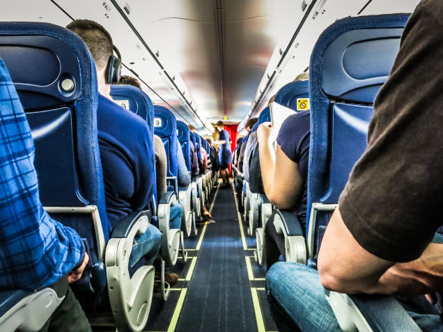 How to Survive Sitting on a Long Flight, According to a Physical Therapist